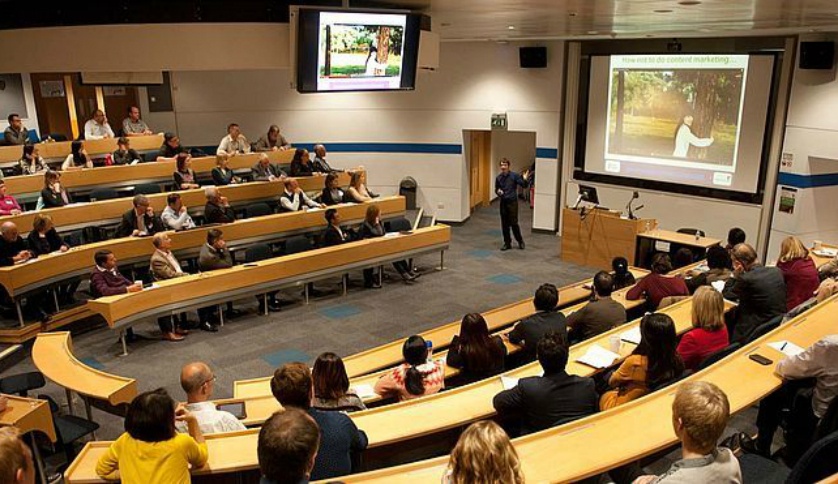 University lecture hall with students attending a virtual class, representing university online courses Australia
